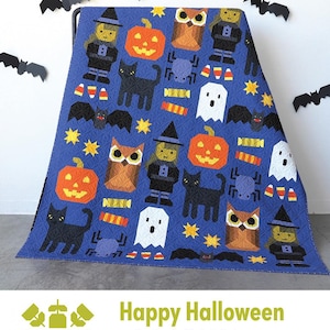 May include: A blue Halloween-themed quilt featuring various appliqued shapes, including pumpkins, owls, witches, ghosts, bats, and candy corn. The quilt has a repeating pattern and the words "Happy Halloween" are displayed at the bottom.