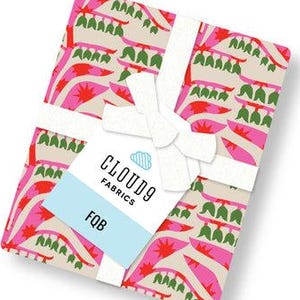 May include: A folded stack of fabric featuring a repeating pattern of pink and red abstract shapes with green accents on a light beige background. A white ribbon is tied around the fabric, holding a tag that reads CLOUD9 FABRICS and FQB.