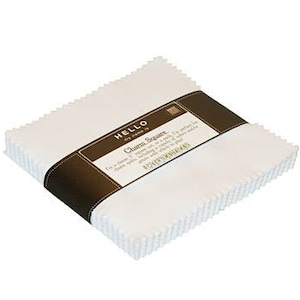 May include: A stack of white fabric squares with a brown label that reads "HELLO my name is Charm Square 5 inch squares with a variety of prints.  BOHO CHARM 200"