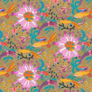 May include: A colorful fabric with a repeating pattern of stylized flowers, fish, and abstract shapes in shades of pink, orange, teal, purple, and yellow on a gold background. The fabric has a whimsical, artistic design. The text "Free Spirit" and "freespiritfabrics.com" are visible.