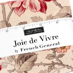 May include: A beige fabric with a floral print featuring pink and red flowers and brown leaves. The fabric is labeled "Joie de Vivre by French General" and has a ruler measuring 8 inches.