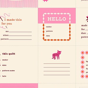 May include: A fabric panel with various pink and cream-colored squares. Each square features text fields labeled "maker," "pattern," and "date," along with phrases like "I made this for you" and "handmade." A pink tiger illustration is also present.