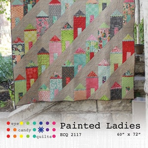 Peut inclure: Un modèle de courtepointe appelé "Painted Ladies" avec un motif de maisons colorées en diagonale. La courtepointe mesure 60 pouces par 72 pouces.