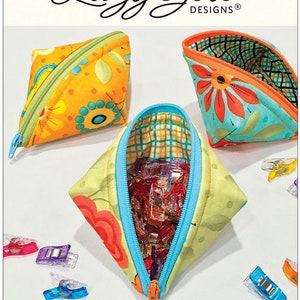 May include: Three colourful fabric zippered pouches with a floral print. The pouches are shaped like a triangle and are open to reveal a bright blue lining. The pouches are filled with colourful plastic clips. The text "SWEETPEA PODS" is at the bottom of the image. The text "Securely hold treasures like peas in a pod! Tuck inside a bag, attach to your key chain, or add a strap for a mod wristlet. Un-zipped pod stands open for easy access. Size: 3" x 6" www.LazyGirlDesigns.com" is below the image.