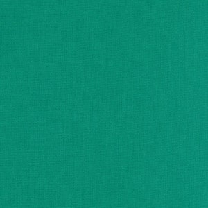 May include: Solid teal fabric with a subtle woven texture. The fabric has a consistent color and a slightly rough surface, suitable for various crafting and sewing projects. The material appears to be a medium weight.