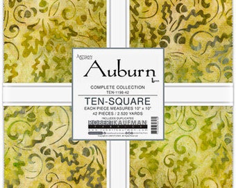 May include: A stack of 42 fabric squares from the Auburn collection by Robert Kaufman, each measuring 10 inches by 10 inches. The fabric features a yellow and green pattern of oak leaves and acorns. A white paper band wraps the stack with text.