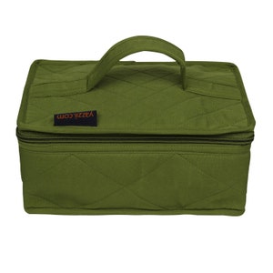 May include: A green quilted storage box with a zipper closure and a handle. The box has a label that says "Yazzii.com".