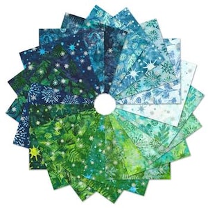 May include: A circular display of fabric squares in shades of blue and green. The fabric features snowflake and winter forest patterns. The arrangement is on a white background, showcasing the variety of designs.