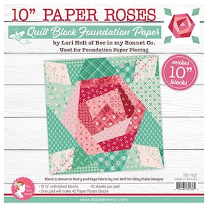 May include: A paper pad for foundation paper piecing, featuring a colorful patchwork rose design. The pad is labeled "10" Paper Roses" and includes the text "Quilt Block Foundation Paper". The finished blocks will measure 10 inches.