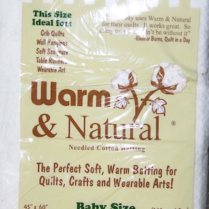 May include: A white package of Warm & Natural Needled Cotton Batting, labeled "Baby Size" with dimensions 45" x 60" (1.14 m x 1.5 m). The package is ideal for crib quilts, wall hangings, soft sculpture, table runners, and wearable art.
