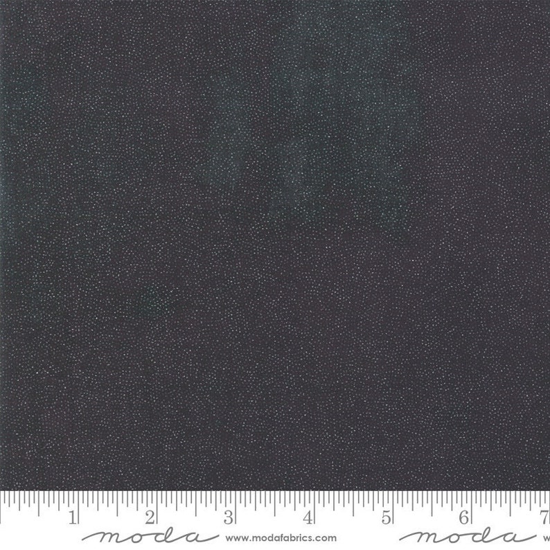 May include: Black fabric with a subtle shimmer, resembling a starry night sky. The fabric is textured with tiny white dots.