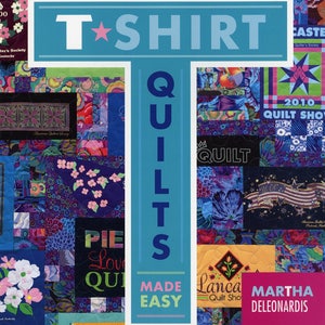May include: A book cover with a blue background and the text "T-SHIRT QUILTS MADE EASY" in white. The cover features a variety of colorful quilt designs and the text "Martha Deleonardis" in pink.