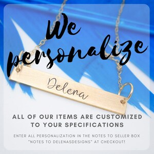 May include: A gold-colored personalized bar necklace with the name "Delena" engraved on it. The necklace hangs against a blue and white background. Text on the image reads "We personalize" and "ALL OF OUR ITEMS ARE CUSTOMIZED TO YOUR SPECIFICATIONS."