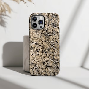 May include: A black phone case with a beige and black abstract pattern. The case has a camera cutout and a raised lip around the edges.