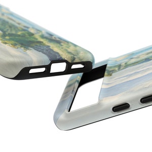May include: Two phone cases with a watercolor-style design. The cases are black and have a cutout for the camera lens. The design features a blue and green landscape.