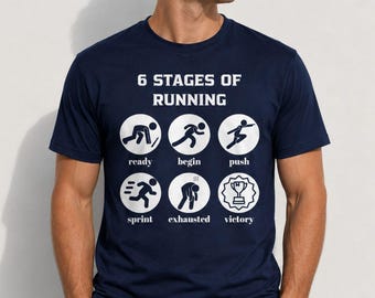 May include: A navy blue short-sleeve t-shirt featuring a white graphic print titled 6 STAGES OF RUNNING. The design displays six circular icons with stick figures illustrating the stages: ready, begin, push, sprint, exhausted, and victory.