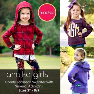 May include: A collage of children's clothing. A red plaid hooded sweater, a purple long-sleeved shirt with a gold monogram, and a purple hooded sweatshirt. The text "annika girls" and "Comfy Lapneck Sweater with Several Add-Ons" are visible.