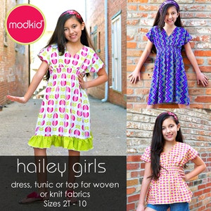 May include: A sewing pattern for a girls' dress, tunic, or top. The pattern is called "hailey girls" and is available in sizes 2T-10. The pattern is for woven or knit fabrics. The image shows three girls wearing different versions of the dress.