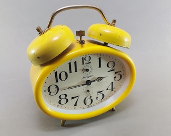 Sveglia vintage Jerger gialla a doppia campana, prodotta in Germania, orologio da scrivania retrò a carica manuale.
