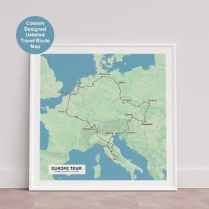 May include: A framed Europe Tour map with a detailed travel route marked in black. The map includes cities like Paris, Rome, and Berlin. Text on the map reads "EUROPE TOUR" and "Custom Designed Detailed Travel Route Map."