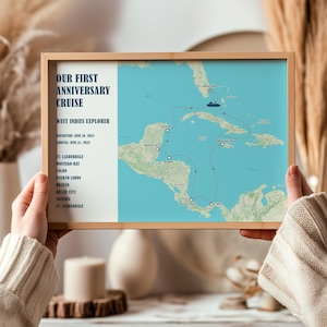 May include: A framed map print detailing a cruise itinerary. The map shows the West Indies Explorer cruise route, with destinations including Ft. Lauderdale, Montego Bay, and Colon. The text reads "Our First Anniversary Cruise" and lists the departure and arrival dates.
