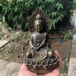 Vintage Bronze Guanyin Bodhisattva holding a lotus flower statue Avalokitesvara Seated ornaments Guan Yin Bodhisattva Goddess of Compassion