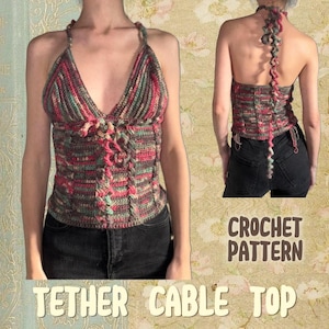 May include: A handmade crochet halter top in a mix of red, green, and brown yarns. The top features a V-neck and a cable design down the front. The words "CROCHET PATTERN" and "TETHER CABLE TOP" are visible in the image.