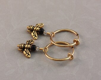 Clip hoop earrings with Antique Gold honeybee beads and Black Onyx by EarthsOpulence