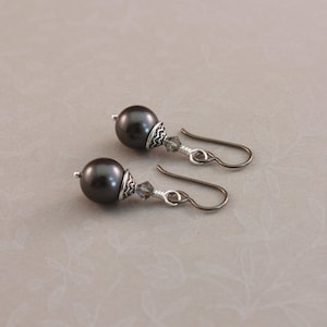 Niobium earrings, hypoallergenic pierced earrings with Black pearls and Lotus bead caps
