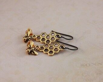 Black Niobium with Honeycomb and Honeybees: niobium earrings with bees and flowers