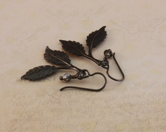 Niobium earrings, black Niobium with Vintaj Arte Metal beech leaves, by EarthsOpulence