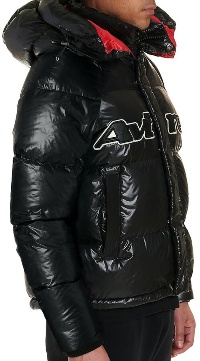 May include: Black puffer jacket with a glossy finish and a hood. The jacket features a red lining in the hood and a white and black logo on the chest. The jacket is designed for cold weather and has a quilted pattern.