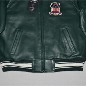 May include: A set of three ceramic mugs with a speckled, matte finish. The mugs are in shades of blue, green, and white. Each mug has a simple, modern design, suitable for coffee or tea.