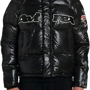 May include: Black puffer jacket with a red-lined hood. The jacket features the white text "Avirex" across the chest. A small logo is on the right sleeve. The jacket has a shiny, quilted appearance.