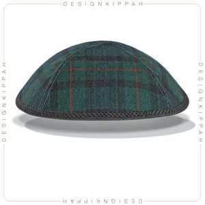 May include: A green and black plaid kippah with a black trim. The kippah has a red stripe pattern.