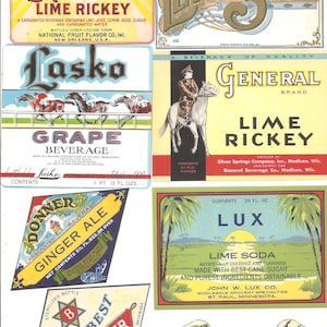 May include: A collection of vintage soda and beverage labels. The labels feature colorful designs and text, including "Squeeze Lime Rickey," "Lemon Soda," "Grape Beverage," and "Bud's Best Root Beer." The labels showcase various brands and styles.