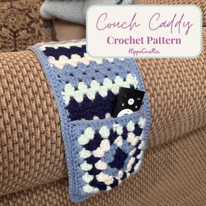 May include: A crocheted couch caddy in shades of blue, white, and navy blue, featuring a granny square design. The caddy has a pocket holding a remote control. Text on the image reads "Couch Caddy Crochet Pattern HippoCraftic."