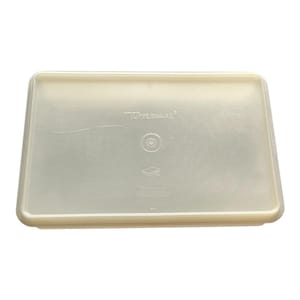 May include: A rectangular, off-white Tupperware container lid. The lid has a slightly raised edge and a smooth, matte finish. The Tupperware logo is visible on the top surface. The lid is designed to fit a rectangular food storage container.