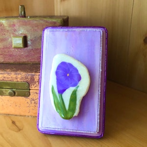 Purple Petunia Rock Hand Painted on a Quartz Stone Set on a small Wall hanging Wooden plaque
