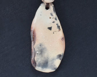 Sagger fired ceramic pendant with 3mm leather cord, steel bayonet clasp and stone beads.