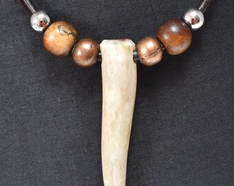 Shed antler pendant with steel, copper and vintage wooden beads. 3mm leather cord with stainless bayonet clasp. one of a kind