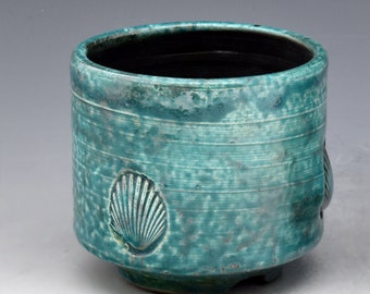 Handmade, wheel thrown stoneware tea bowl chawan. Shell impressed, Raku fired, one of a kind. R220