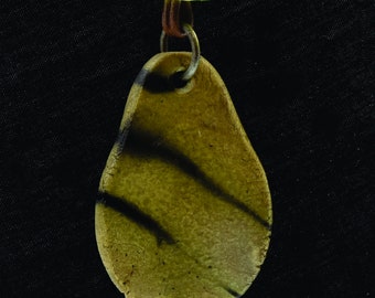 Sagger fired ceramic pendant 36with glass and leather additions