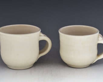 Handmade wheel thrown porcelain cups. This pair is unique clear glaze over white porcelain ac5