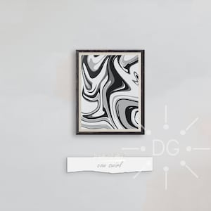 May include: A framed abstract art print with a swirling pattern in shades of gray and black. The artwork is mounted in a dark wooden frame and hangs on a light gray wall. Below the artwork is a white label with the text "cow swirl".