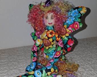 Whimsical, fiber sculpted flower fairy, silk face, Swarovski crystal accents