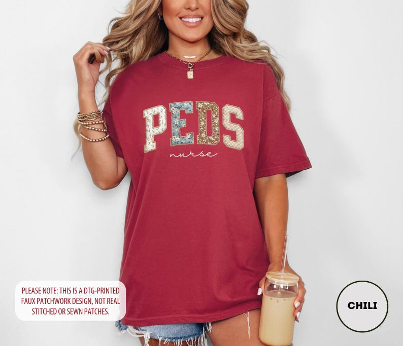 May include: A maroon t-shirt with the word "PEDS" in a faux patchwork design, with the word "nurse" below it. The shirt is a relaxed fit and has short sleeves. The text "PLEASE NOTE: THIS IS A DTG-PRINTED FAUX PATCHWORK DESIGN, NOT REAL STITCHED OR SEWN PATCHES." is at the bottom.