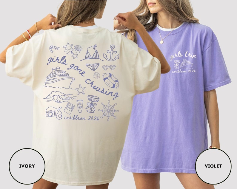 Puede incluir: Dos camisetas de gran tama&ntilde;o, una marfil y otra violeta. La camiseta marfil presenta un gr&aacute;fico azul con el texto "girls gone cruising caribbean 2026" e ilustraciones n&aacute;uticas. La camiseta violeta tiene "girls trip caribbean 2026" en blanco.