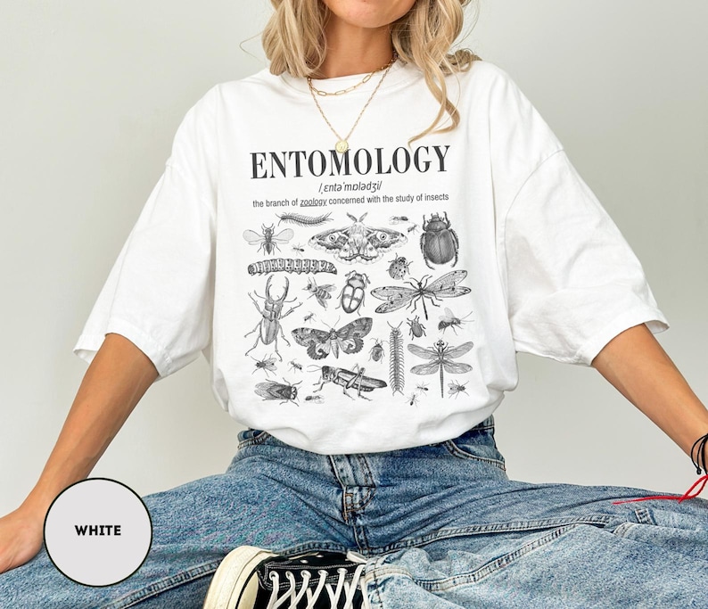 May include: White t-shirt with a black and white illustration of various insects and the text "ENTOMOLOGY /ˈɛntəˈmɒlədʒi/ the branch of zoology concerned with the study of insects"