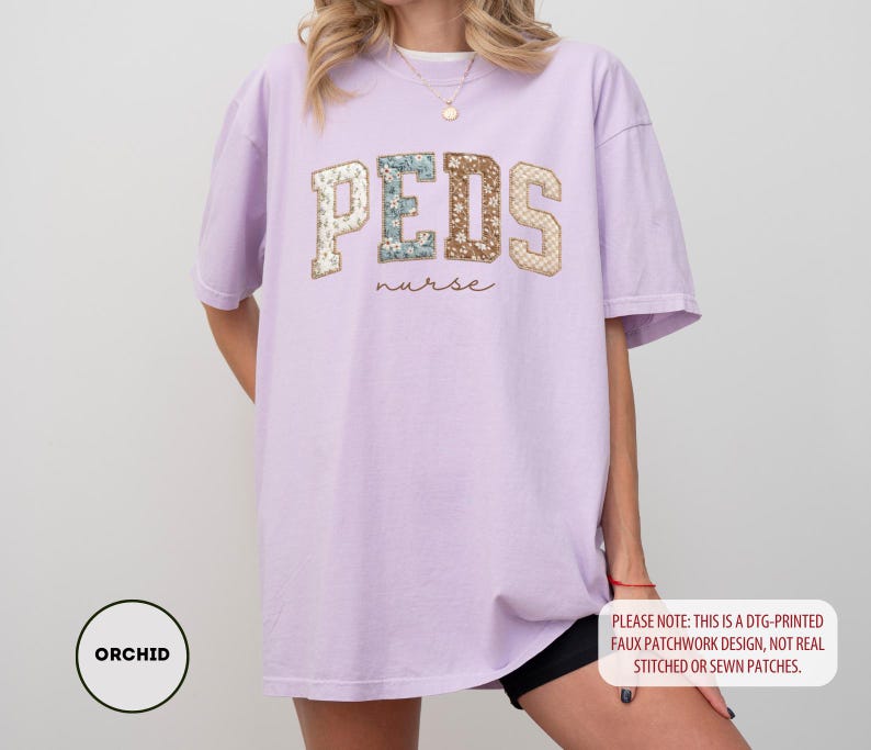 May include: A light purple t-shirt with the word "PEDS" in a patchwork design, with the word "nurse" underneath. The shirt also has the word "ORCHID" in a circle on the bottom left. The shirt is a DTG-printed faux patchwork design.